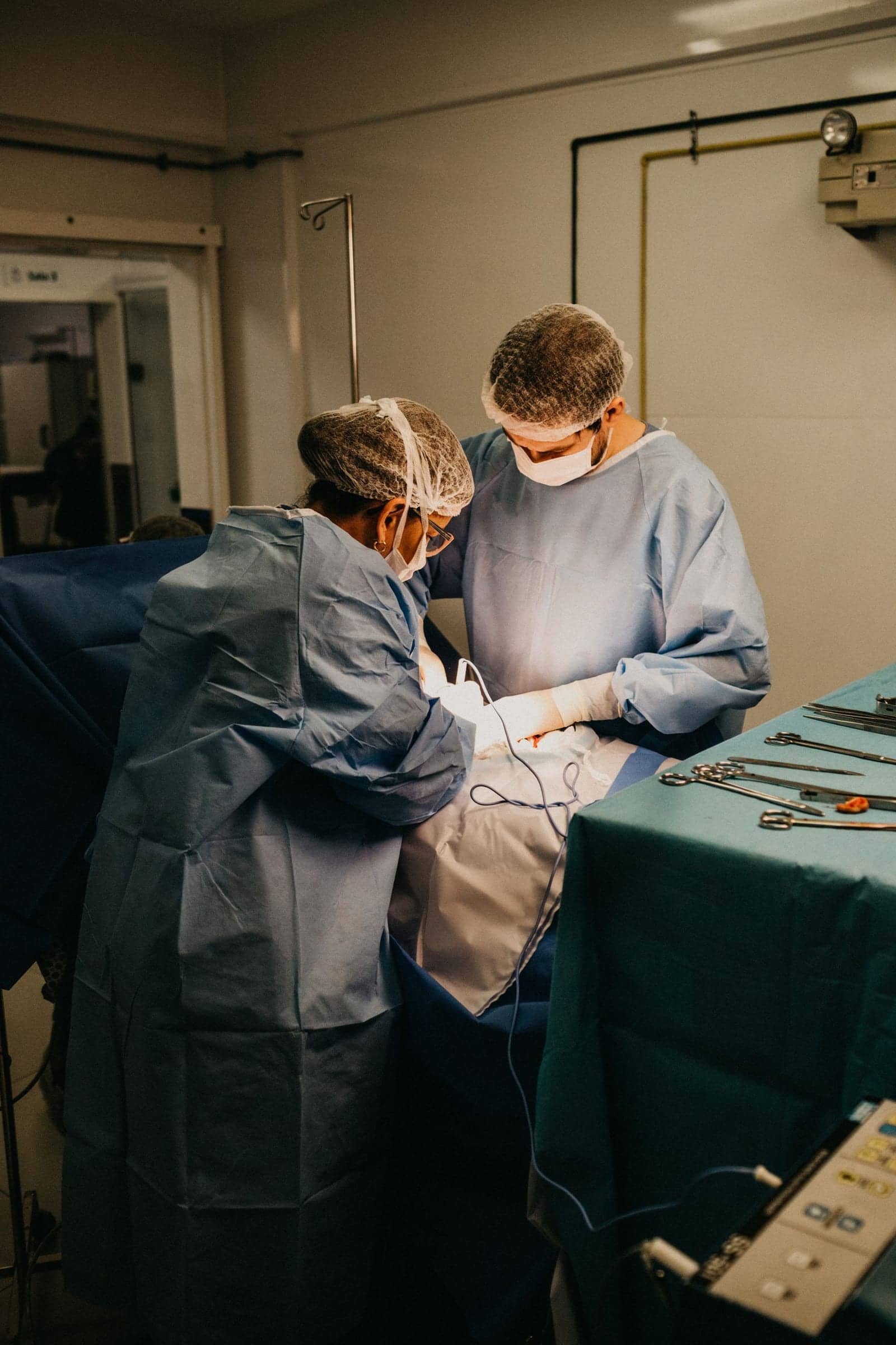Two surgeons at work in an operating theatre